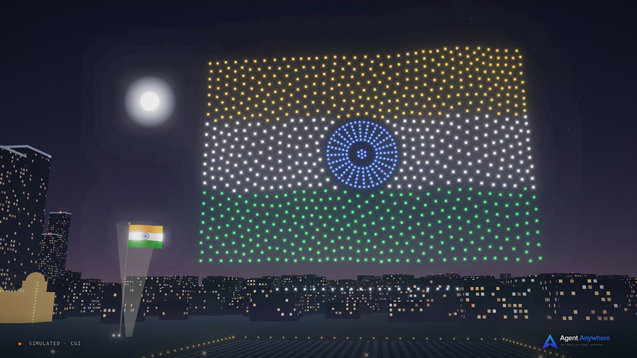 Simulated CGI: a drone light show paints the Indian national flag, with the Ashoka Chakra in blue, in points of light above a night-time riverfront skyline.